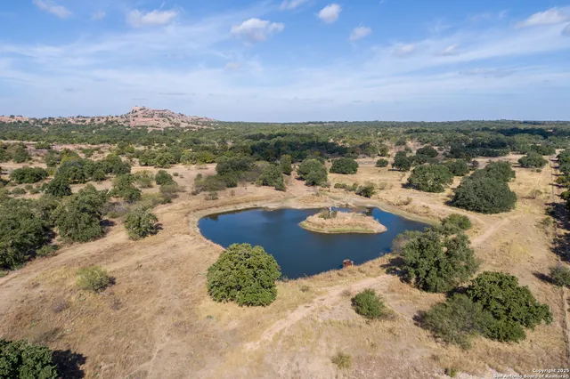a view of a lake with houses in the back