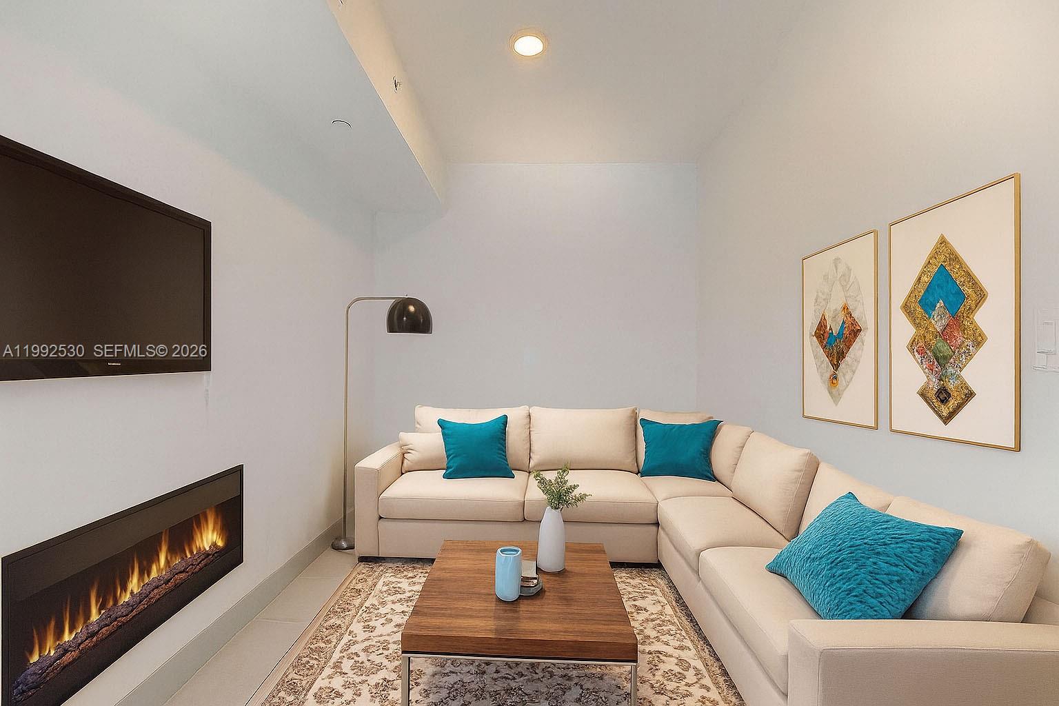 519 Southwest 5th Avenue, Unit 203 Miami, FL 33130 - Photo 14 of 26 a living room with furniture and a flat screen tv