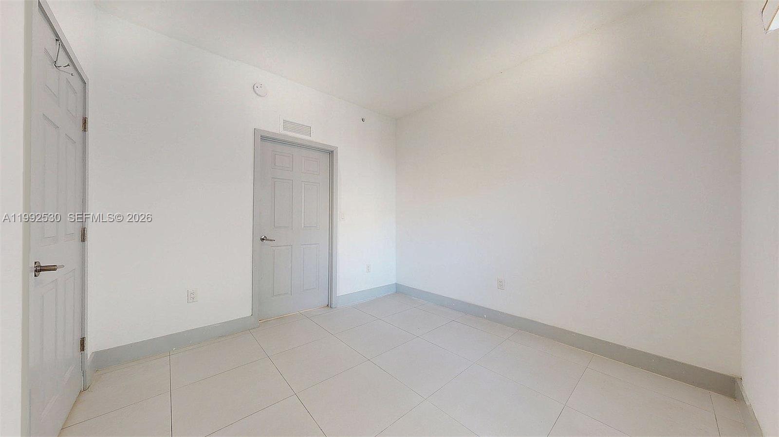 519 Southwest 5th Avenue, Unit 203 Miami, FL 33130 - Photo 22 of 26 a view of an empty room