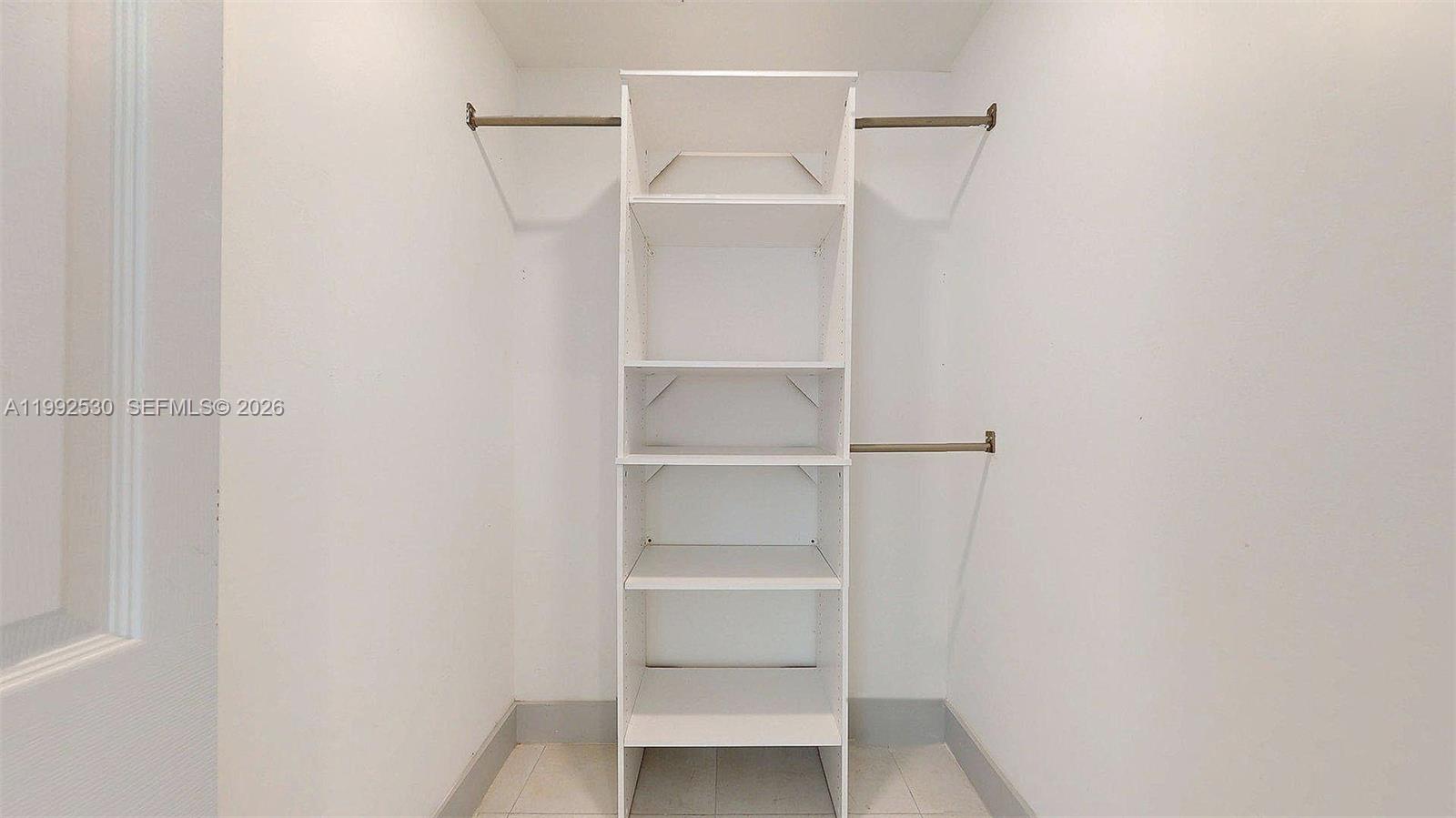 519 Southwest 5th Avenue, Unit 203 Miami, FL 33130 - Photo 24 of 26 a view of an empty walk in closet