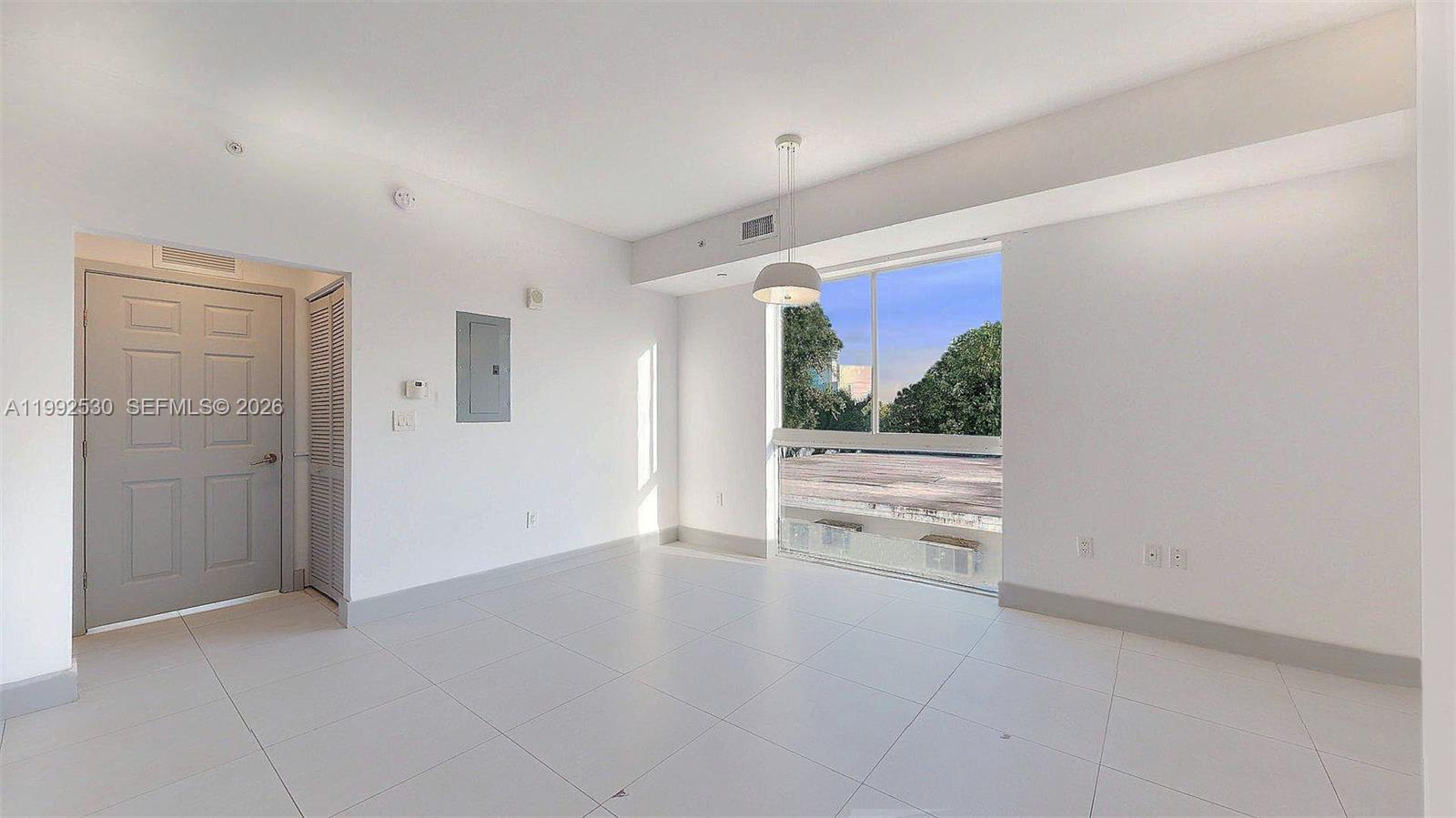 519 Southwest 5th Avenue, Unit 203 Miami, FL 33130 - Photo 9 of 26 wooden floor in an empty room