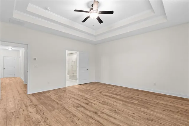 a bathroom with a granite countertop sink a shower and a mirror