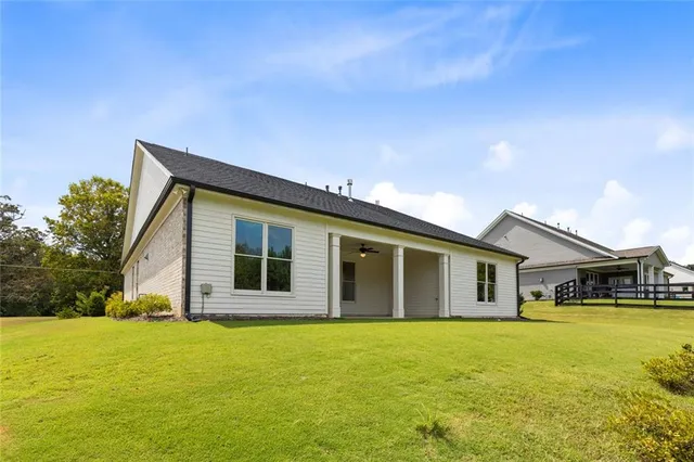 a view of a swimming pool with an outdoor seating and a garden