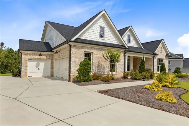 an aerial view of a house with a swimming pool