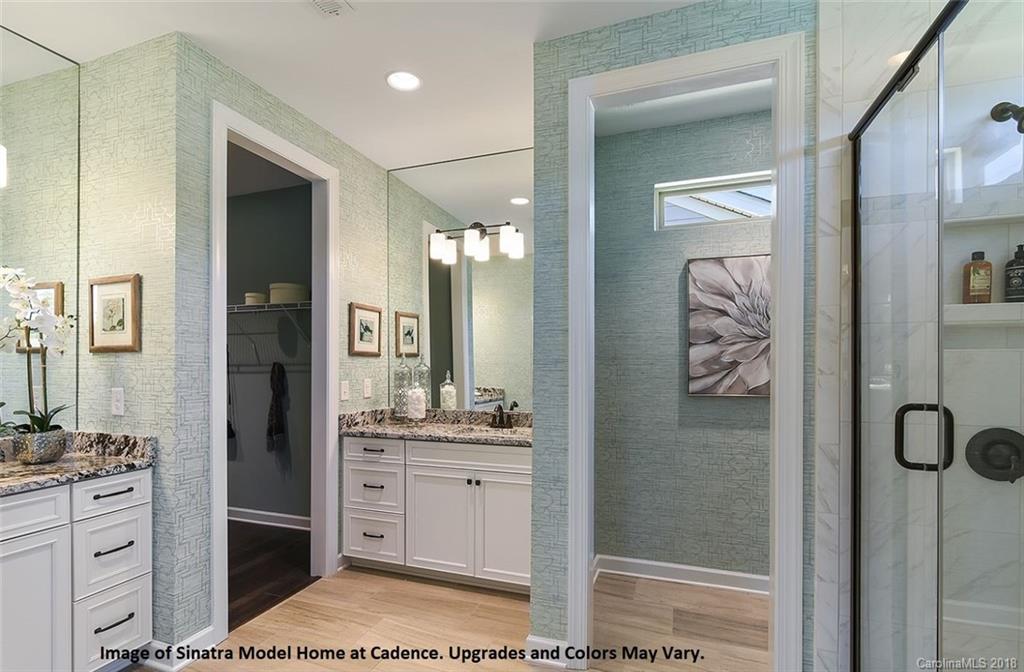 1267 Independence Street, Unit 81 Tega Cay, SC 29708 - Photo 7 of 10 a bathroom with a shower a sink and a mirror
