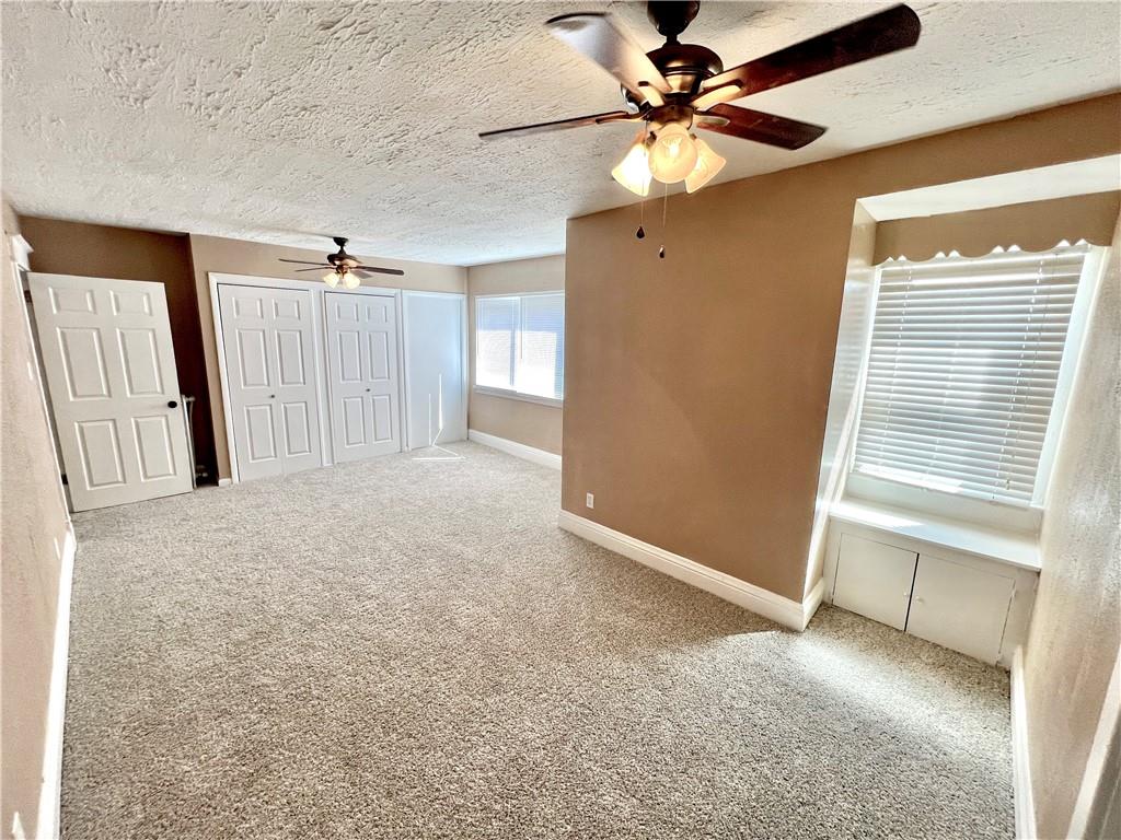 1032 Main Street Republic, PA 15475 - Photo 19 of 39 an empty room with windows and fan
