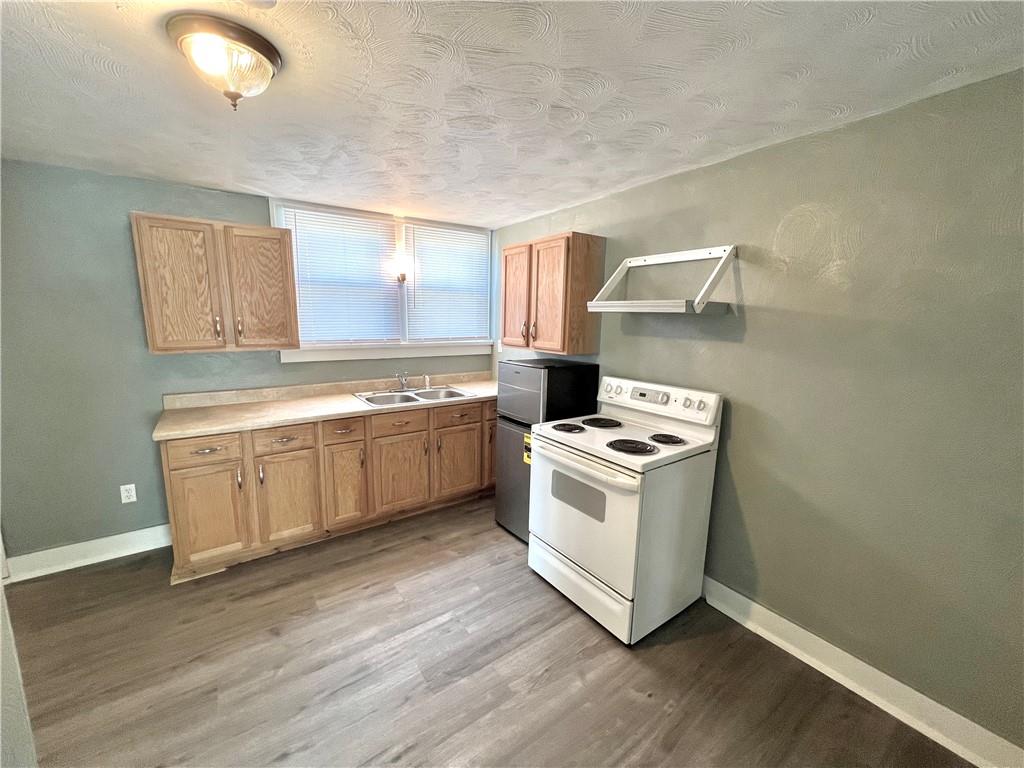 1032 Main Street Republic, PA 15475 - Photo 29 of 39 a view of washer and dryer with wooden floor