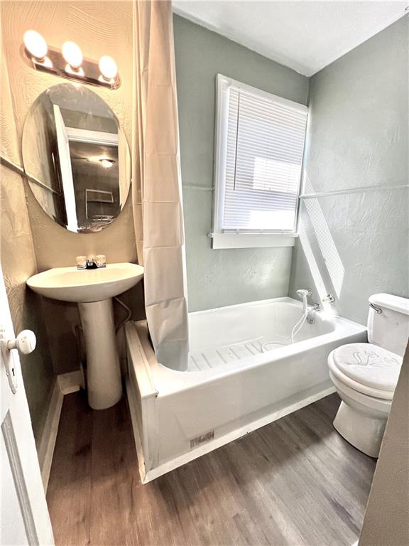 1032 Main Street Republic, PA 15475 - Photo 30 of 39 a bathroom with a sink a toilet and a bathtub