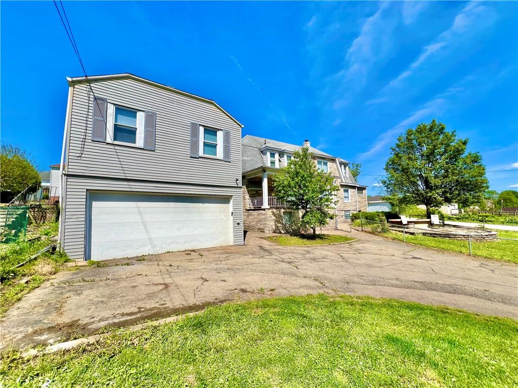 1032 Main Street Republic, PA 15475 - Photo 4 of 39 a front view of a house with a yard