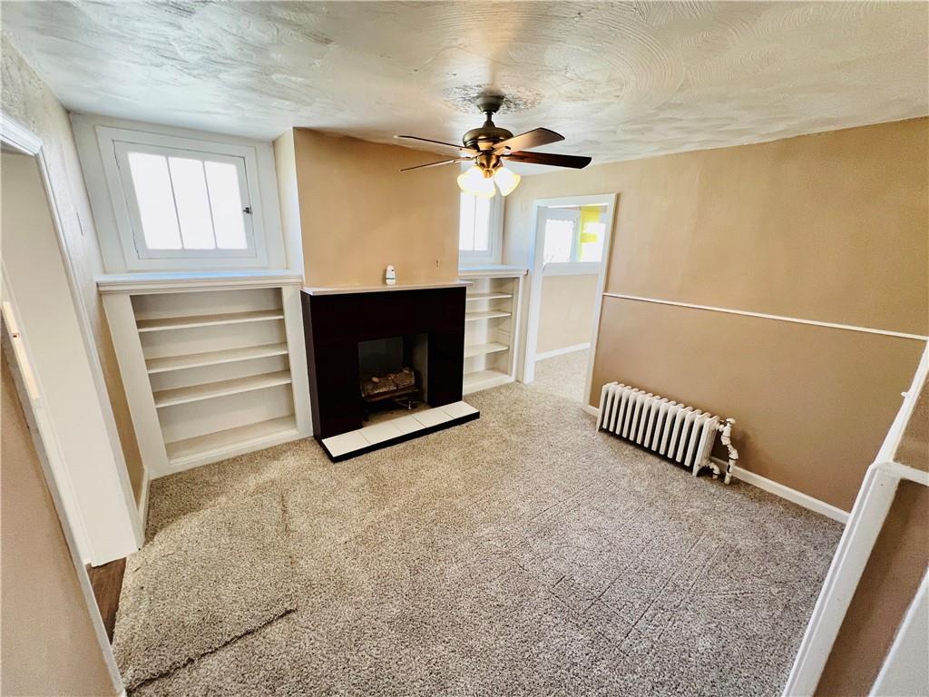 1032 Main Street Republic, PA 15475 - Photo 7 of 39 a bedroom with furniture and a fireplace