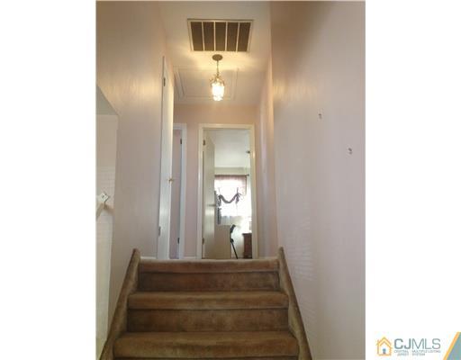 29 Sherwood Road Edison, NJ 08820 - Photo 12 of 12 a view of a hallway with staircase
