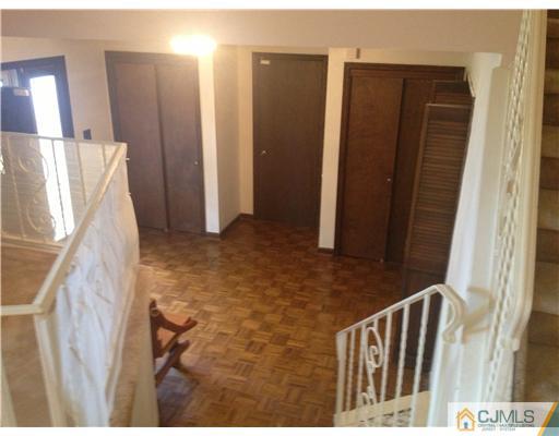 29 Sherwood Road Edison, NJ 08820 - Photo 3 of 12 a view of staircase with wooden floor