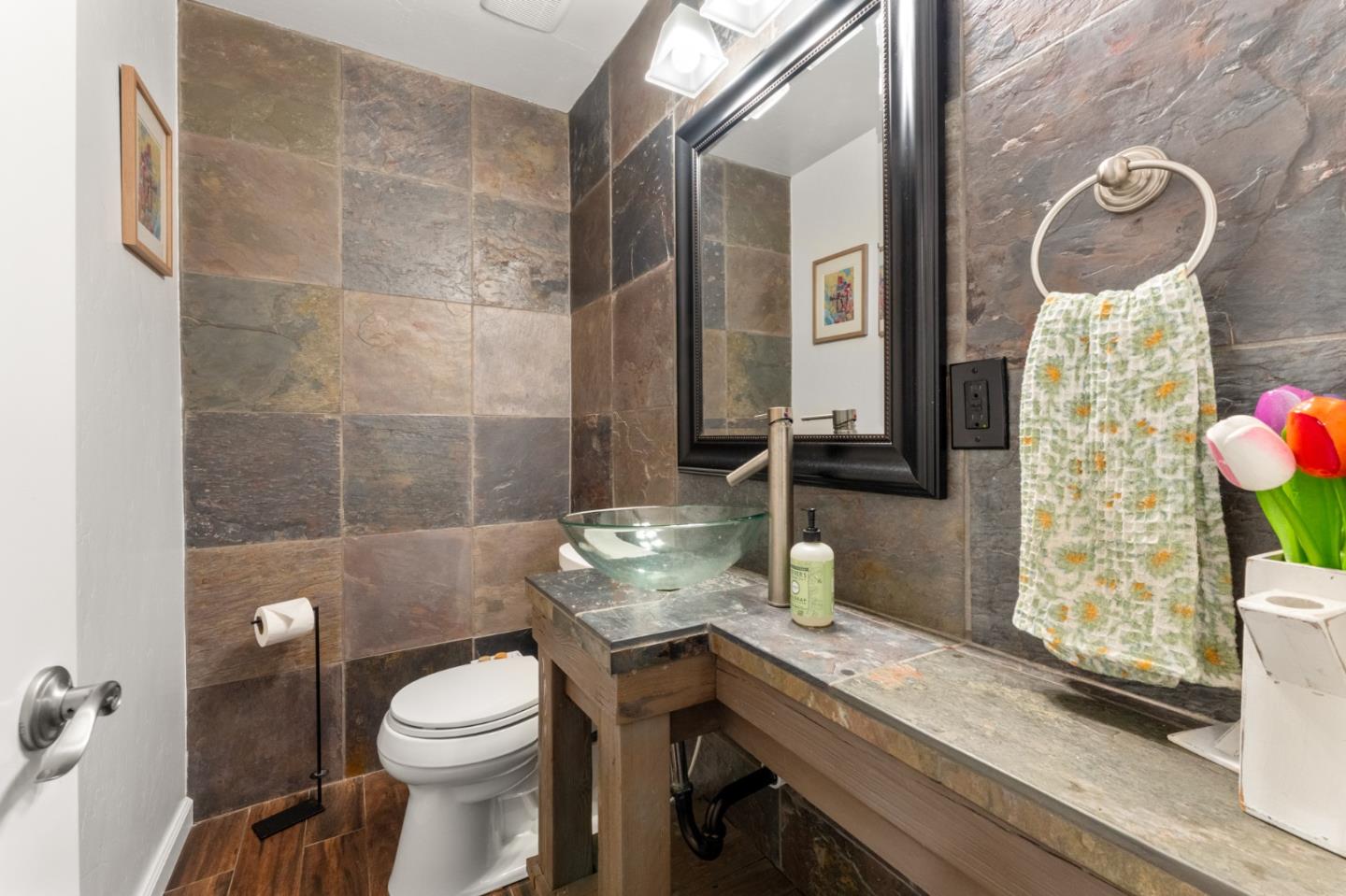 140 Baker Road Aptos, CA 95003 - Photo 26 of 62 a bathroom with a granite countertop sink a toilet and a mirror