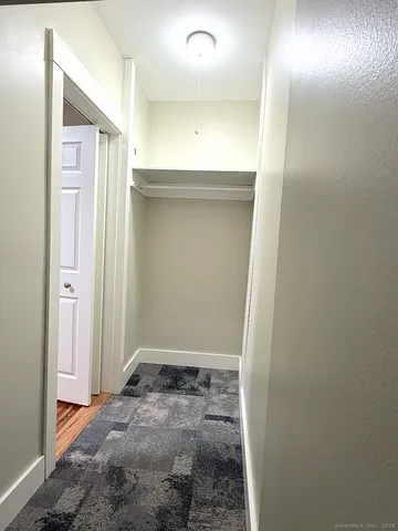 view of room with a sink and mirror