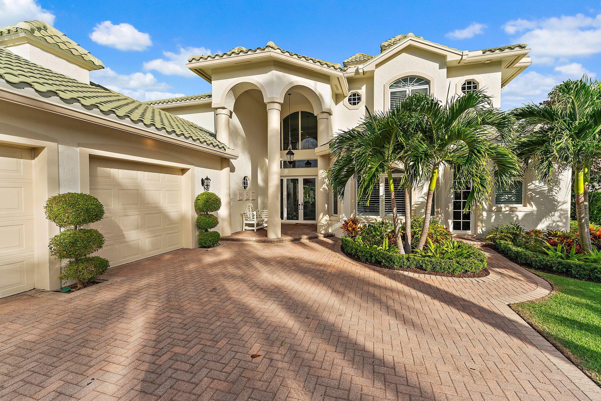 17129 Southeast Limerick Court Tequesta, FL 33469 - Photo 13 of 80 a front view of a house with a yard