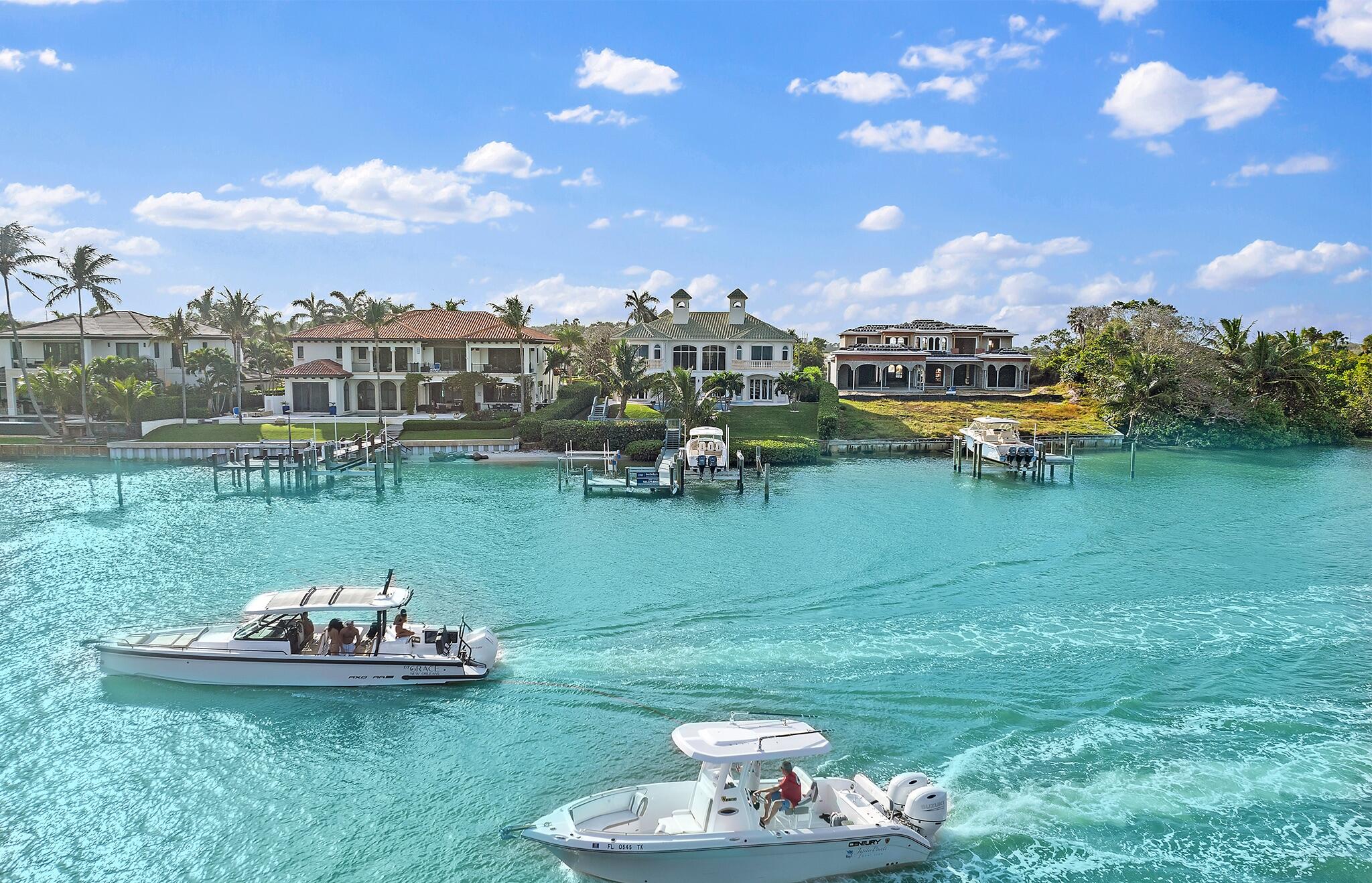17129 Southeast Limerick Court Tequesta, FL 33469 - Photo 5 of 80 a view of a lake with a house in the background