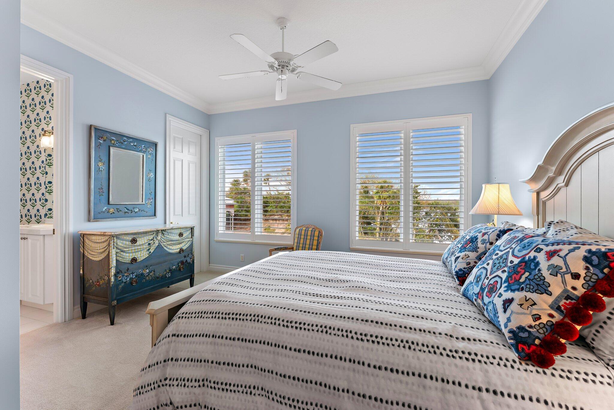 17129 Southeast Limerick Court Tequesta, FL 33469 - Photo 55 of 80 a bedroom with a bed and a window