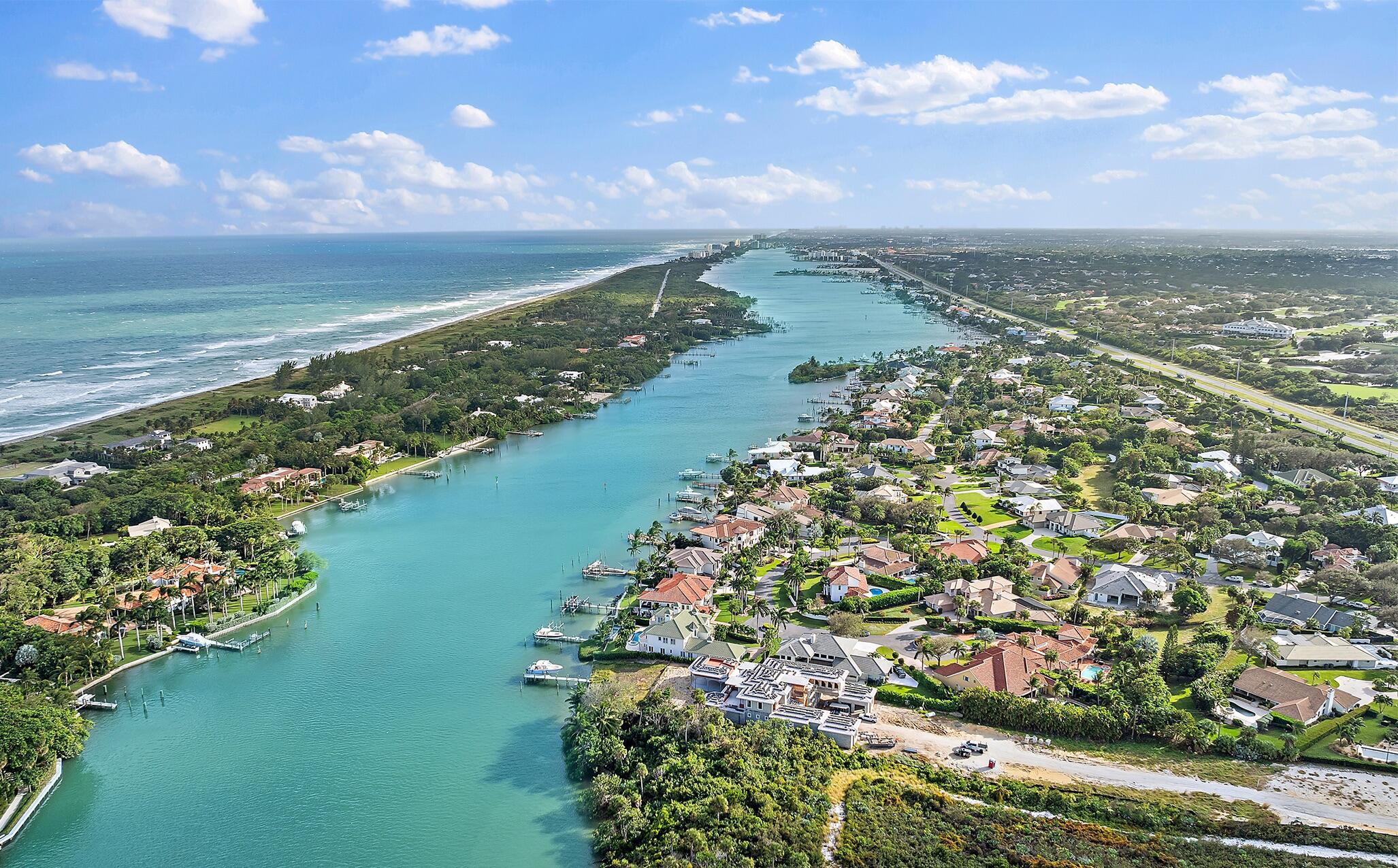 17129 Southeast Limerick Court Tequesta, FL 33469 - Photo 77 of 80 a view of a lake with a city
