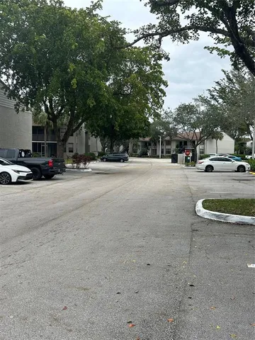 a view of a street with a parked cars