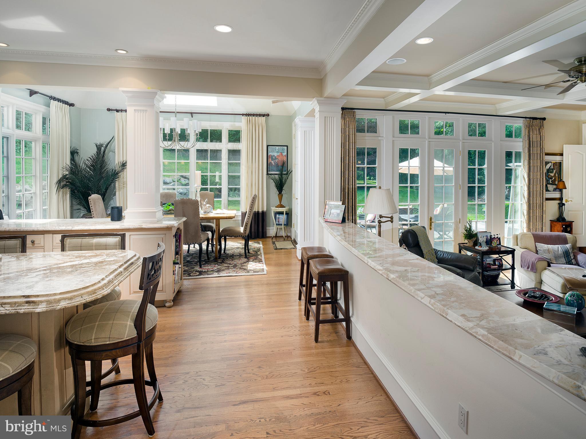 805 Montparnasse Place Newtown Square, PA 19073 - Photo 7 of 13 a large living room with large windows and furniture