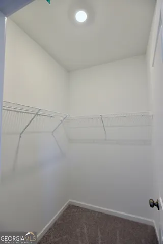 a view of a house with a yard and plants