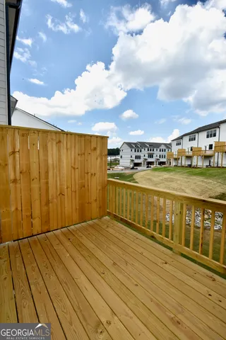 a view of a swimming pool with an outdoor seating