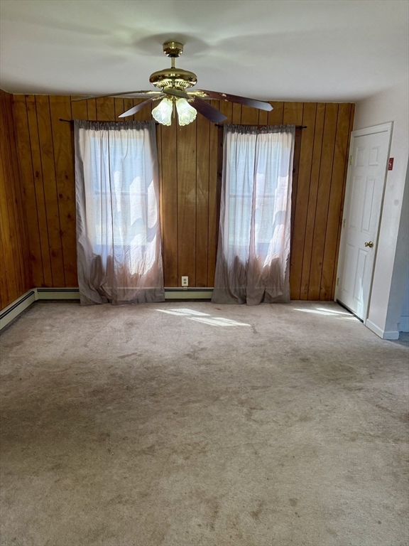 111 Hayden Street Orange, MA 01364 - Photo 11 of 26 an empty room with windows and fan
