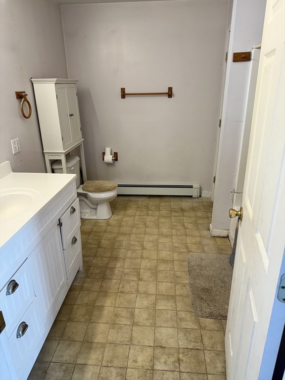 111 Hayden Street Orange, MA 01364 - Photo 25 of 26 a bathroom with a granite countertop sink a toilet and a shower
