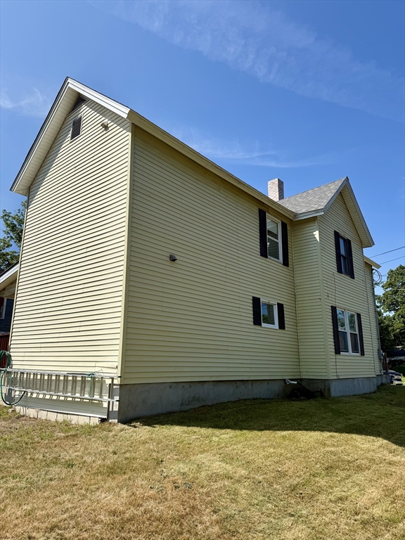 111 Hayden Street Orange, MA 01364 - Photo 3 of 26 a front view of a house with a yard