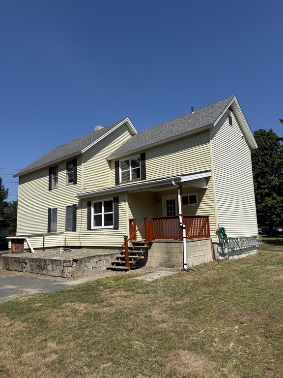 111 Hayden Street Orange, MA 01364 - Photo 4 of 26 a view of a lounge chair in front of house