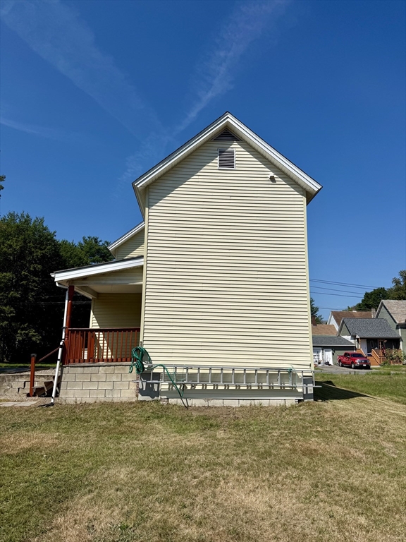 111 Hayden Street Orange, MA 01364 - Photo 5 of 26 a front view of a house with a yard