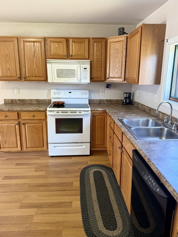 111 Hayden Street Orange, MA 01364 - Photo 9 of 26 a kitchen with granite countertop a sink stove and cabinets