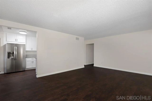 a kitchen with a sink stove top oven and cabinets