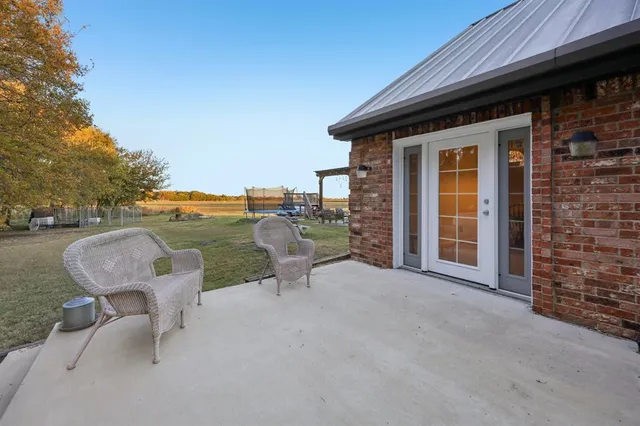 a view of a terrace with outdoor seating and yard