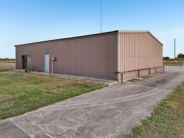 a view of a backyard with potted plants