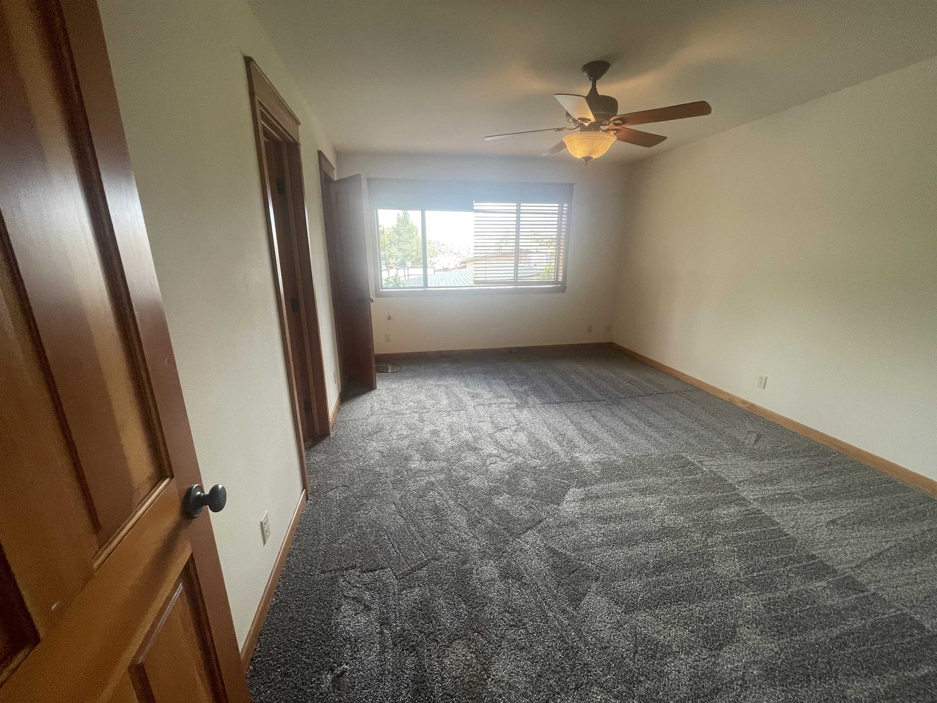 117 Summit Road, Unit 2 Bishop, CA 93514 - Photo 11 of 19 an empty room with windows and fan