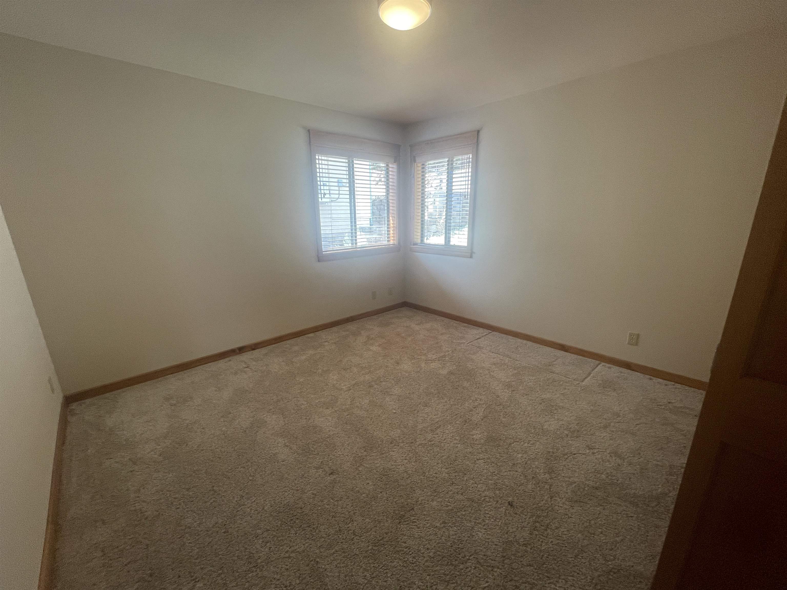 117 Summit Road, Unit 2 Bishop, CA 93514 - Photo 13 of 19 an empty room with windows