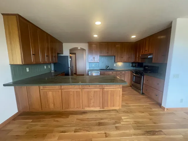 a large kitchen with cabinets