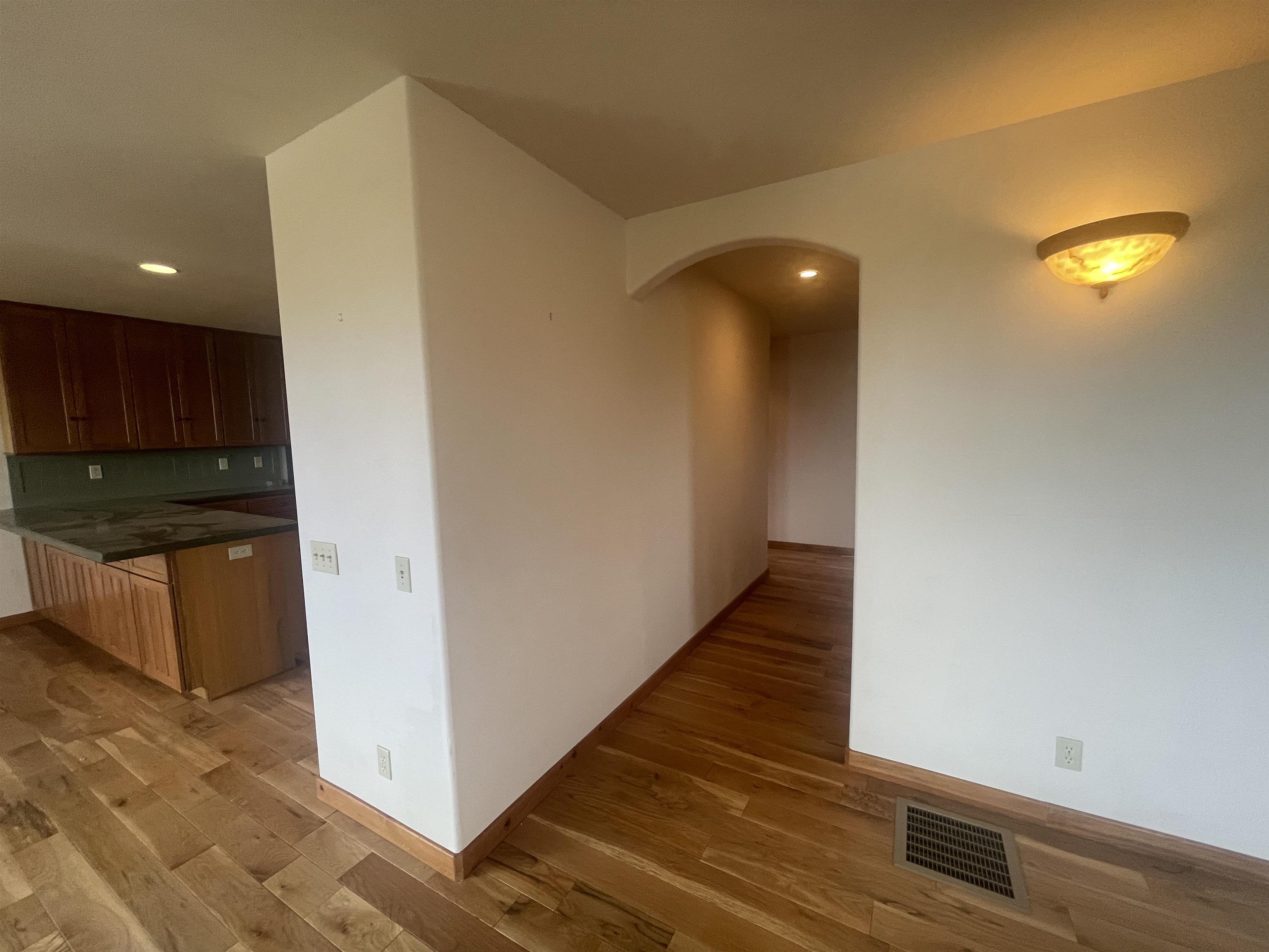 117 Summit Road, Unit 2 Bishop, CA 93514 - Photo 10 of 19 a view of a hallway with wooden floor and staircase