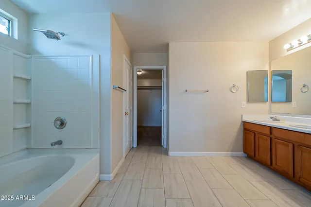a bathroom with a bathtub and shower