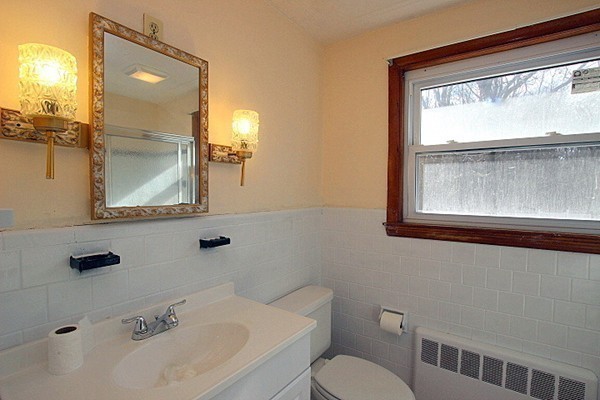 111 Silver Brook Road Milton, MA 02186 - Photo 13 of 28 a bathroom with a toilet a sink and mirror