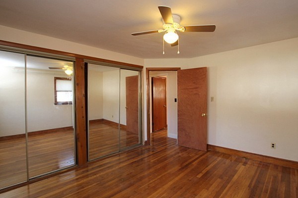111 Silver Brook Road Milton, MA 02186 - Photo 18 of 28 wooden floor in an empty room with a window