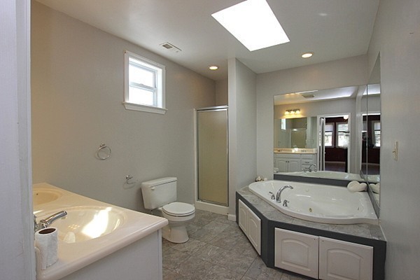 111 Silver Brook Road Milton, MA 02186 - Photo 22 of 28 a bathroom with a granite countertop sink a toilet and shower