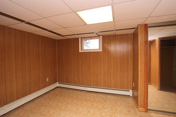 111 Silver Brook Road Milton, MA 02186 - Photo 25 of 28 a view of a room with a wooden door