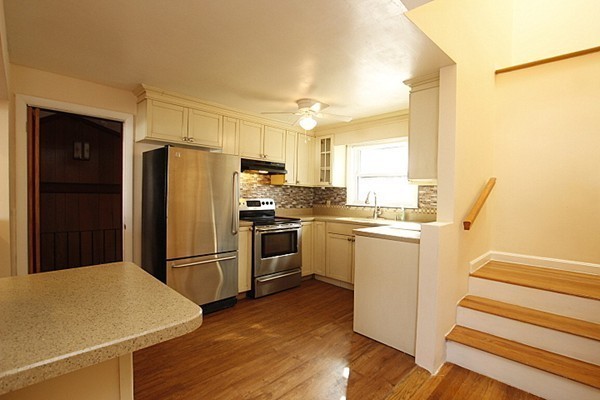 111 Silver Brook Road Milton, MA 02186 - Photo 4 of 28 a kitchen with a refrigerator and a sink