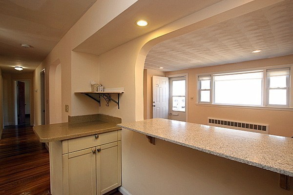 111 Silver Brook Road Milton, MA 02186 - Photo 8 of 28 a large kitchen with kitchen island a sink appliances and a counter space