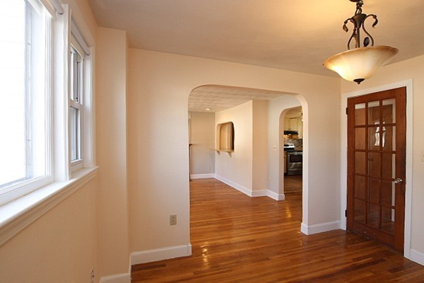 111 Silver Brook Road Milton, MA 02186 - Photo 10 of 28 a view of hallway with wooden floor and stairs