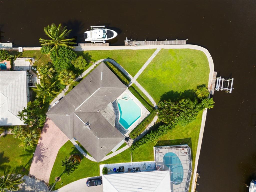 2140 Shad Court Naples, FL 34102 - Photo 14 of 44 an aerial view of a house with a swimming pool