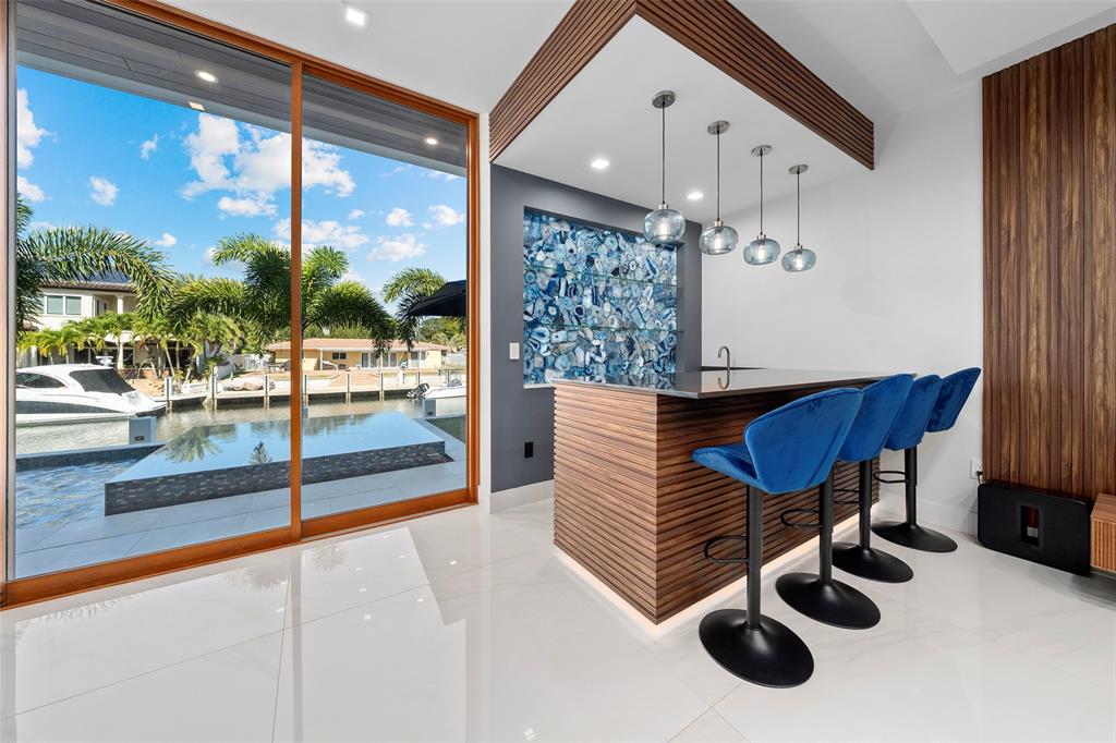 2631 Northeast 48th Court Lighthouse Point, FL 33064 - Photo 13 of 74 a room with furniture and view of wooden floor