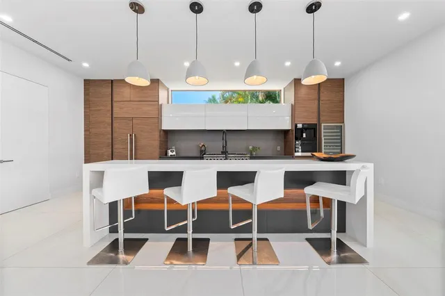 a large space with wooden floor and natural light